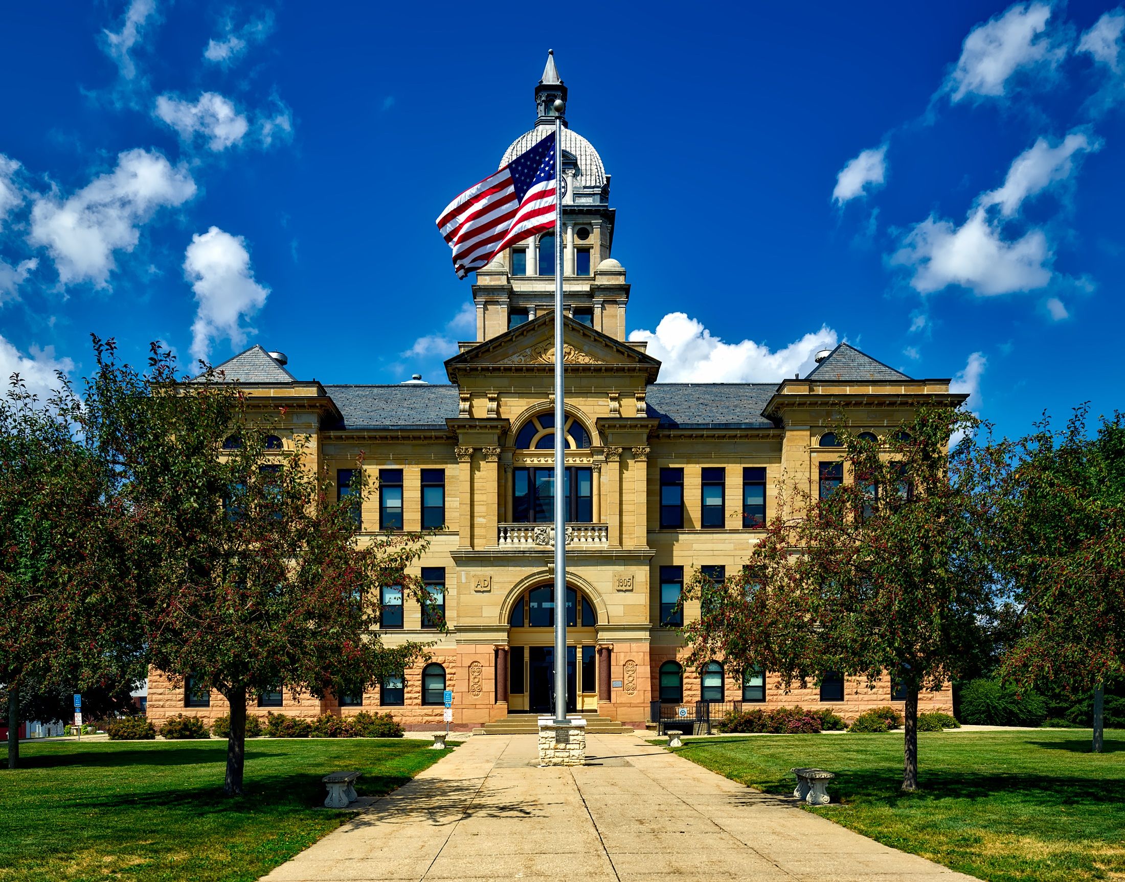 Grand courthouse representing the rule of law and public institutions.