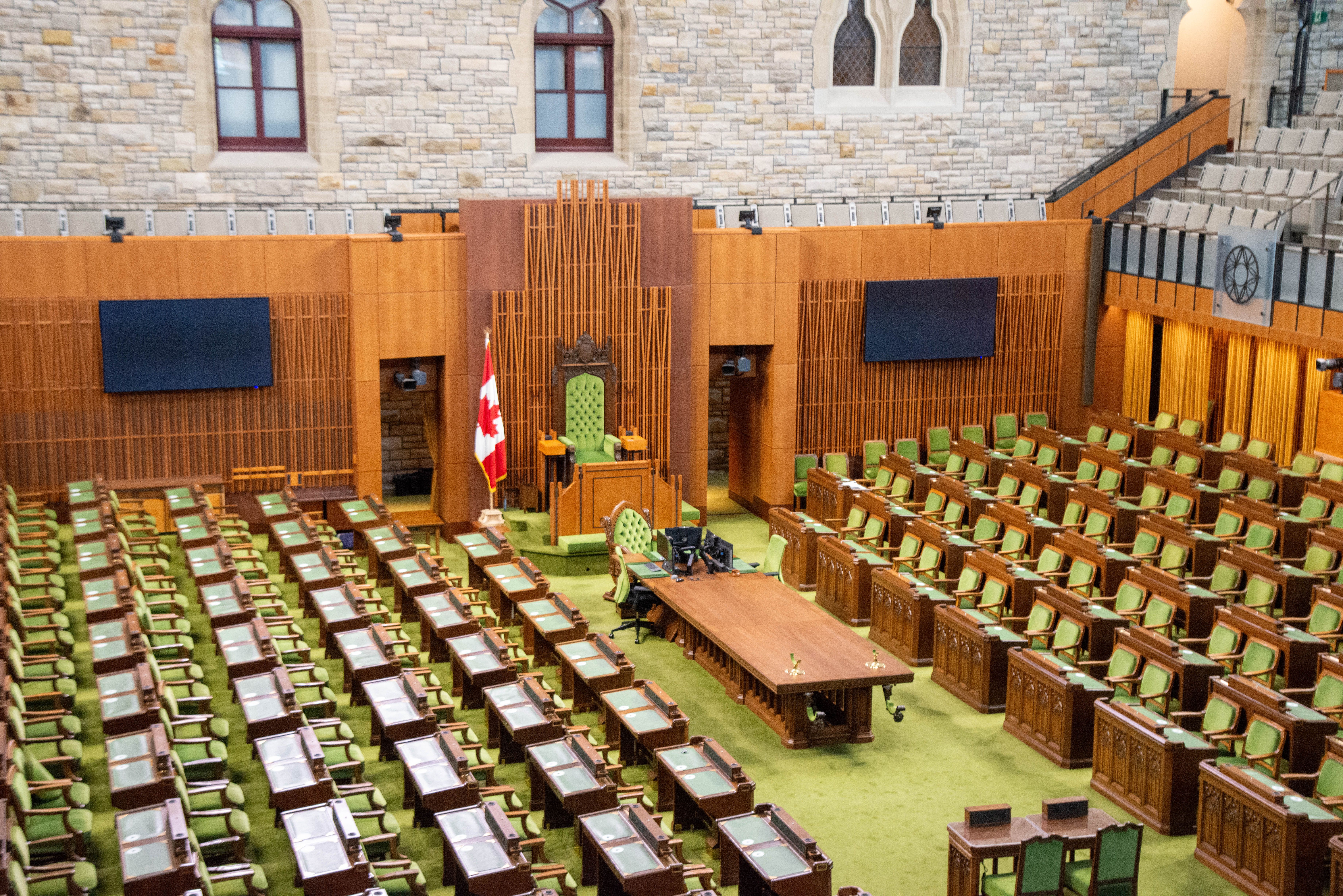 Interior of a legislative chamber illustrating public decision-making and oversight.